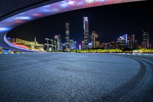 Asphalt road square and bridge with modern city buildings at night in Guangzhou