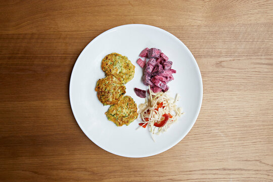Latkes with beetroot and cabbage salad