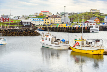 Fishing village with colourful buildings in Iceland on a cloudy summer day