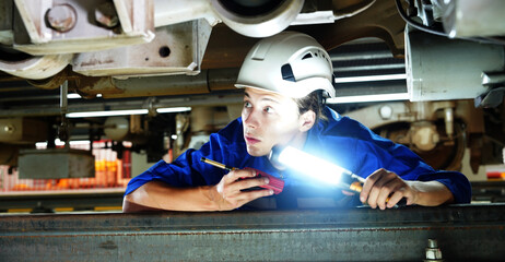 Electric Train Maintenance Training Center, male engineer employees wearing uniforms conduct safety...