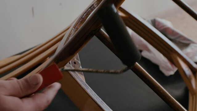 Restoration of a wooden chair. Covering with dark varnish. Close-up. Vintage things. High quality 4k footage