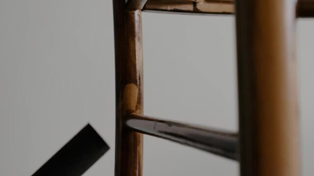 Restoration of a wooden chair. Covering with dark varnish. Close-up. Vintage things. High quality 4k footage