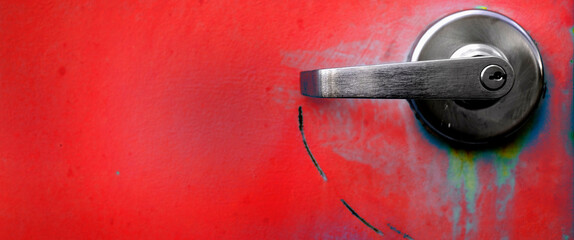 Red Industrial Metal Door with Handles for Opening and Locks Security