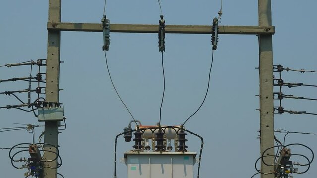 Close-up electrical transformer on a power line pole