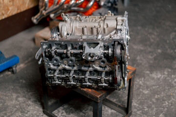 Disassembled engine block on the table the mechanic opened the locking valve mechanism Motor...