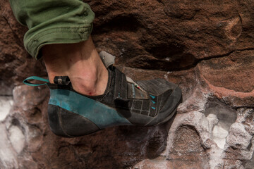 Detail of a climber's climbing foot while climbing