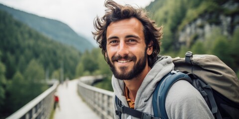 A male tourist stands on a mountain bridge in the Alps. Generative AI.