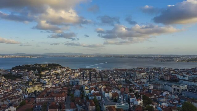 Lisbon Old Town Skyline and Tagus River at Sunset. Golden Hour. Portugal. Aerial Hyper Lapse, Time Lapse. Drone Flies Forward