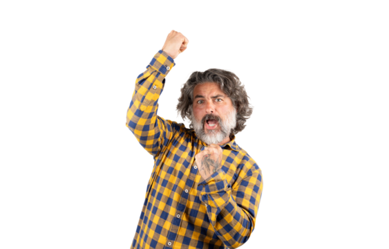 Expressive man celebrating while raising his arms and shouting