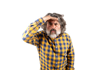 Middle aged man looking away with his hand on his head isolated on a white background