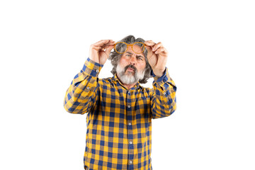 man looking at dirty glasses lenses on white background