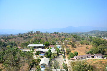 Aerial view landscape local Rim Kok village rural and Chiangrai country countryside on mountain hill of Wat Huay Pla Kang temple for thai people a foreign traveler travel visit in Chiang Rai, Thailand