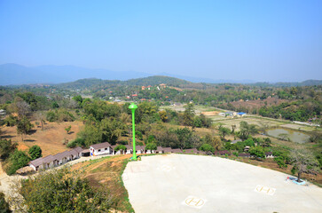 View landscape Rim Kok village country countryside on mountain hill with tower tank water artesian groundwater in aquifers of small village in outdoor park at Chiangrai rural in Chiang Rai, Thailand