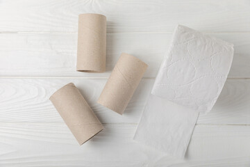 Empty toilet paper roll. Rolls of toilet paper on a white background. Paper tube of toilet paper. Place for text. Copy space. Flat lay. Eco-friendly reuse recycle