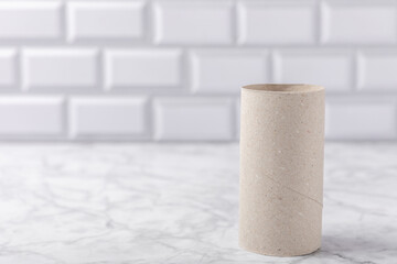 Empty toilet paper roll. Empty toilet paper rolls on marble background. Paper tube of toilet paper....