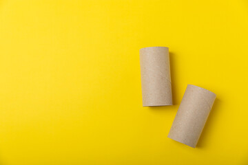 Empty toilet paper roll. Empty toilet paper rolls for the toilet, on a bright yellow background....