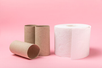 Empty toilet paper roll. Empty toilet paper rolls  for on pink background. Paper tube of toilet paper. Place for text. Copy space. Flat lay. Eco-friendly reuse recycle