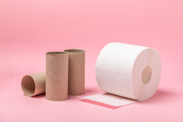 Empty toilet paper roll. Empty toilet paper rolls  for on pink background. Paper tube of toilet paper. Place for text. Copy space. Flat lay. Eco-friendly reuse recycle