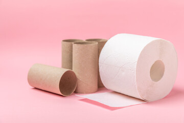 Empty toilet paper roll. Empty toilet paper rolls  for on pink background. Paper tube of toilet paper. Place for text. Copy space. Flat lay. Eco-friendly reuse recycle