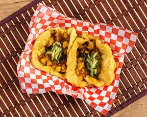Jamaican or Trinidadian or Indian doubles, a snack of curry chick peas in bara fried dough