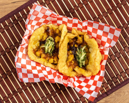 Jamaican or Trinidadian or Indian doubles, a snack of curry chick peas in bara fried dough