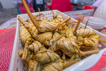 Triangle malay ketupat in a basket