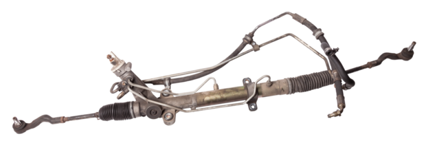 Spare part of the car steering rack new in plastic packaging for turning the wheels close-up on the floor of the tile to perform vehicle maintenance in auto service.