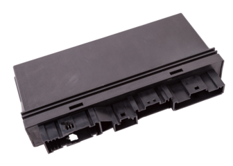 Plastic car engine control unit with metal elements on a white isolated background is the connecting center of various subsystems, units and assemblies. Monitoring the state of the moment. Spare part