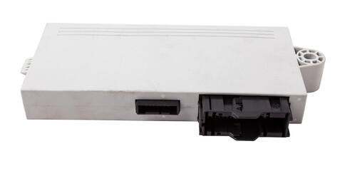 Plastic car engine control unit with metal elements on a white isolated background is the...