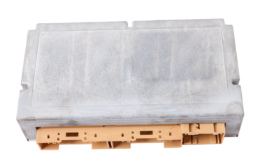 Plastic car engine control unit with metal elements on a white isolated background is the connecting center of various subsystems, units and assemblies. Monitoring the state of the moment. Spare part