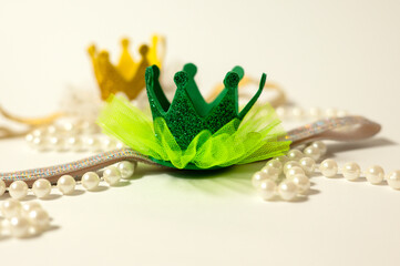Toy crown and pearl necklace