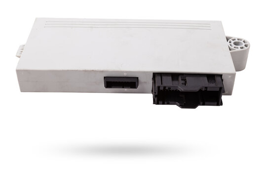 Plastic car engine control unit with metal elements on a white isolated background is the connecting center of various subsystems, units and assemblies. Monitoring the state of the moment. Spare part