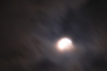Eclipse abstract moving clouds closing sun copy space background image