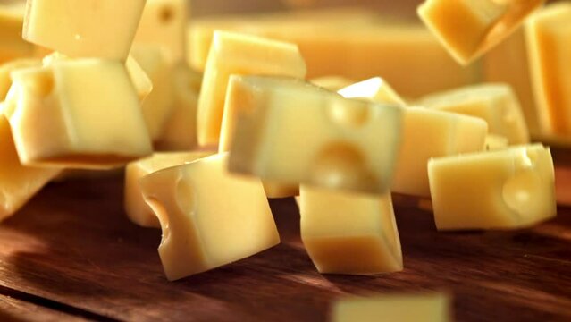Super slow motion pieces of cheese. High quality FullHD footage