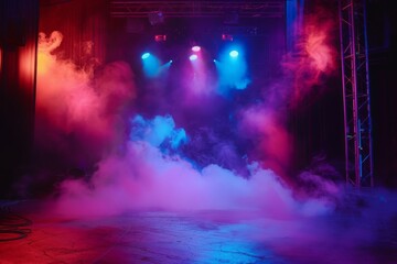 Fototapeta na wymiar A dramatic stage clouded with thick smoke under blue and pink spotlights, suggesting anticipation before an event.