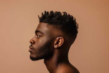 Detailed side portrait of a young man showcasing a trendy fade hairstyle