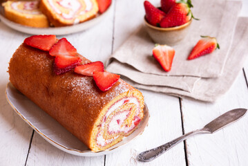 Swiss roll with strawberries and cream, homemde dessert - 781462415