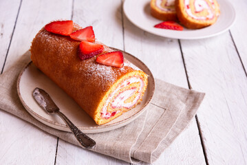 Swiss roll with strawberries and cream, homemde dessert - 781462816