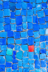 Close up blau background pattern texture with different red stone  Copy space for design.
