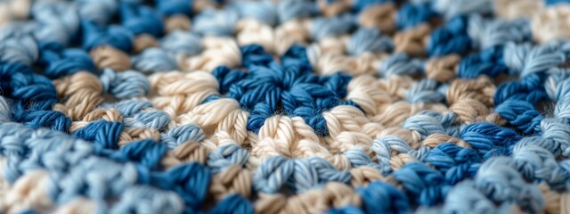 Fototapeta na wymiar Knitted blue background with patterns. Crocheted granny squares. Horizontal close-up photo.