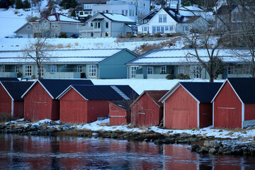 Row of boat garages in Sula island, Norway. - 781466828