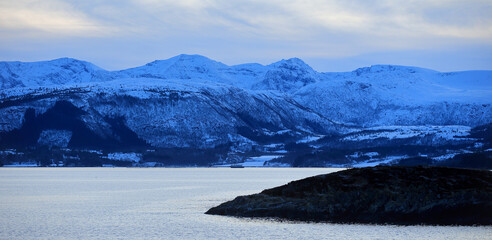 View at the mountains near the Atlantic Ocean Road in winter (Norway).