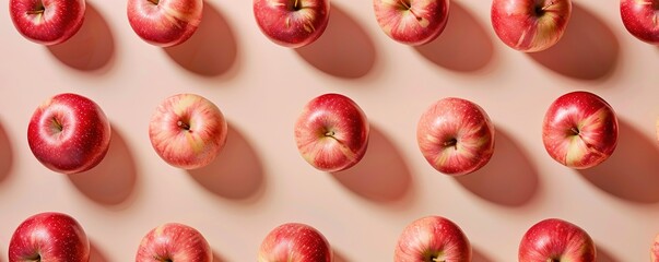Creative pattern made of apple on beige background.