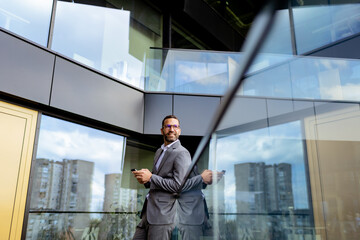 Fototapeta premium Confident Businessman Smiling in Sharp Suit Against Modern Glass Office Facade. Generative AI