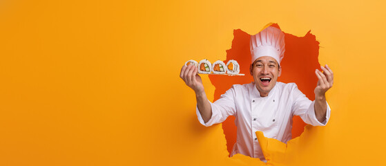 Cheerful chef presenting a sushi roll through a vibrant orange torn paper background