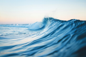 The crystal-clear barrel of a wave captured from inside, with a sunny blue sky above and sparkling water all around.