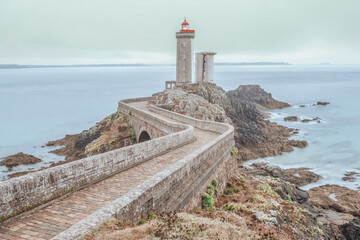 The lighthouse of Petit Minou, located on the coast of the Iroise Sea, is a maritime icon and a historical monument of Brittany. In Plouzane, Brittany, France - 781481461