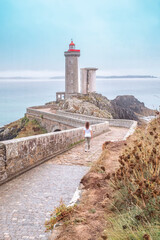 The lighthouse of Petit Minou, located on the coast of the Iroise Sea, is a maritime icon and a historical monument of Brittany. In Plouzane, Brittany, France - 781481487