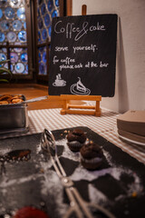 Indulge in a luxurious dessert spread at a Zermatt hotel with chocolate muffins, coffee, and cake....