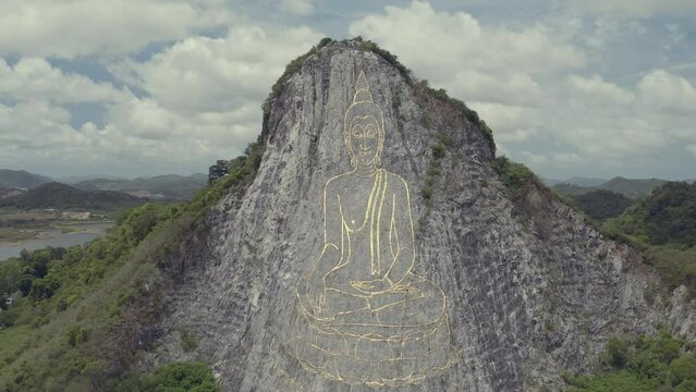 Buddha carved by laser on cliff, the major attractions of Pattaya at Khao Chi Chan Buddha, Pattaya, Chon Buri, Thailand
